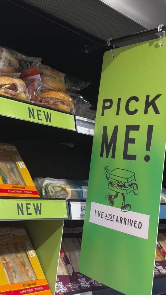 Store shelf with new sandwiches and wraps; sign says "Pick Me! I've just arrived".