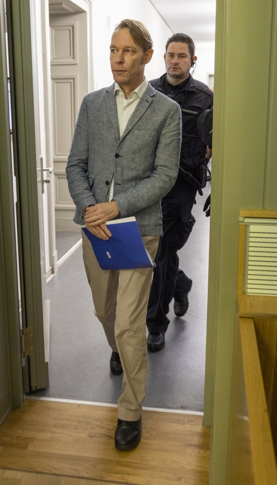 Christian Brueckner, Madeleine McCann's prime suspect, entering a courtroom.