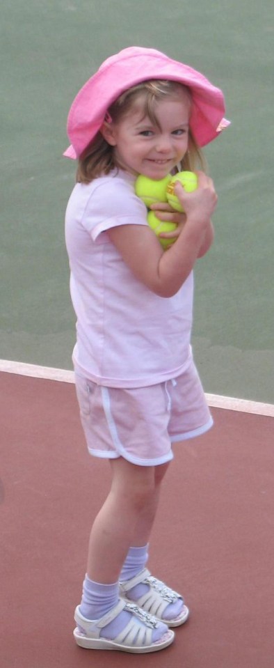 Madeleine McCann, a young child, wearing a pink hat, shirt, and shorts, holding tennis balls on a tennis court.