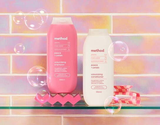 Method brand Peony, Rose Water, Quinoa Protein "Peace + Petals" volumizing shampoo and conditioner bottles.