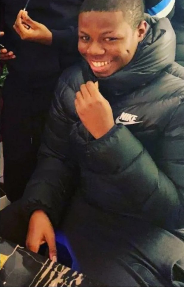 Romario Gordon smiling in a black puffer jacket.