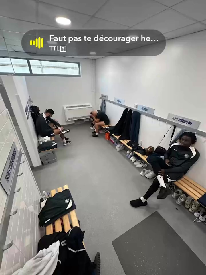 Football players Axel Disasi, Lesley Ugochukwu, and Carney Chukwuemeka in a locker room.