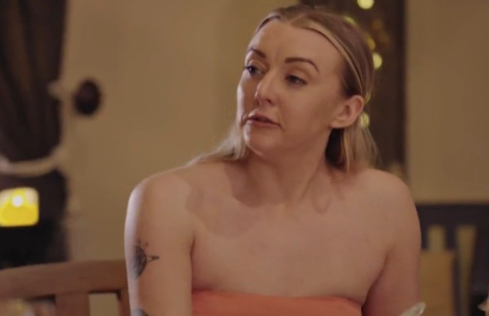 Woman in an orange top.