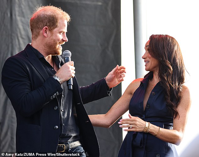 Harry (pictured with Meghan) addressed the crowds at the charity event in Santa Barbara on Saturday