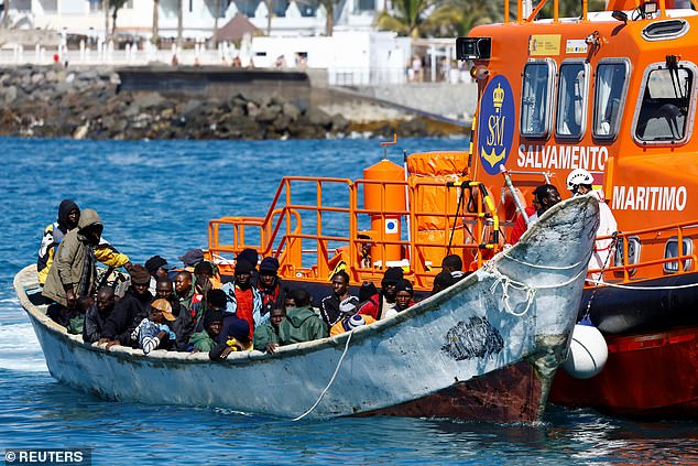 At least 70 migrants found dead off the coast of the Canary Islands are believed to have been murdered and thrown overboard. File photo: A Spanish Coast Guard vessel tows a fibreglass boat with migrants onboard to the port of Arguineguin, on the island of Gran Canaria, Spain, January 29, 2025
