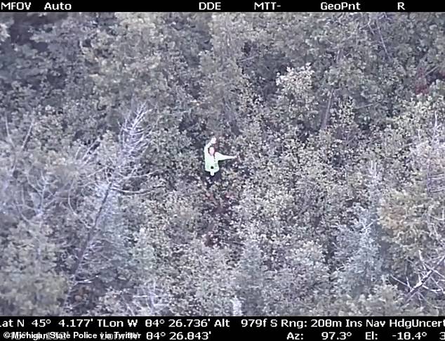A woman who was taking part in a YouTube 'survival challenge' was missing for nearly 18 hours before a Michigan State Police helicopter found her deep in a section of the woods