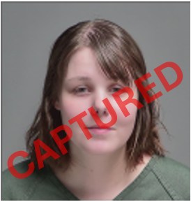 Mugshot of a woman with the word CAPTURED across it.