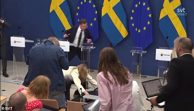 The Deputy PM, Ebba Busch, is seen placing Lann in a recovery position