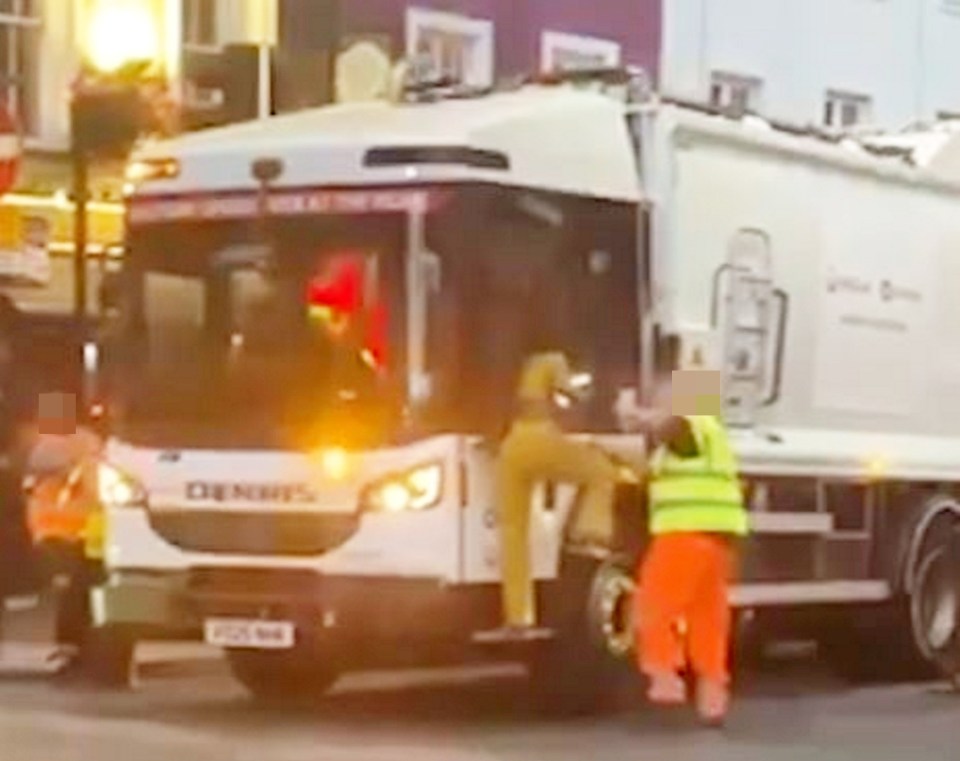 A woman attacking a garbage truck in Camden, London.