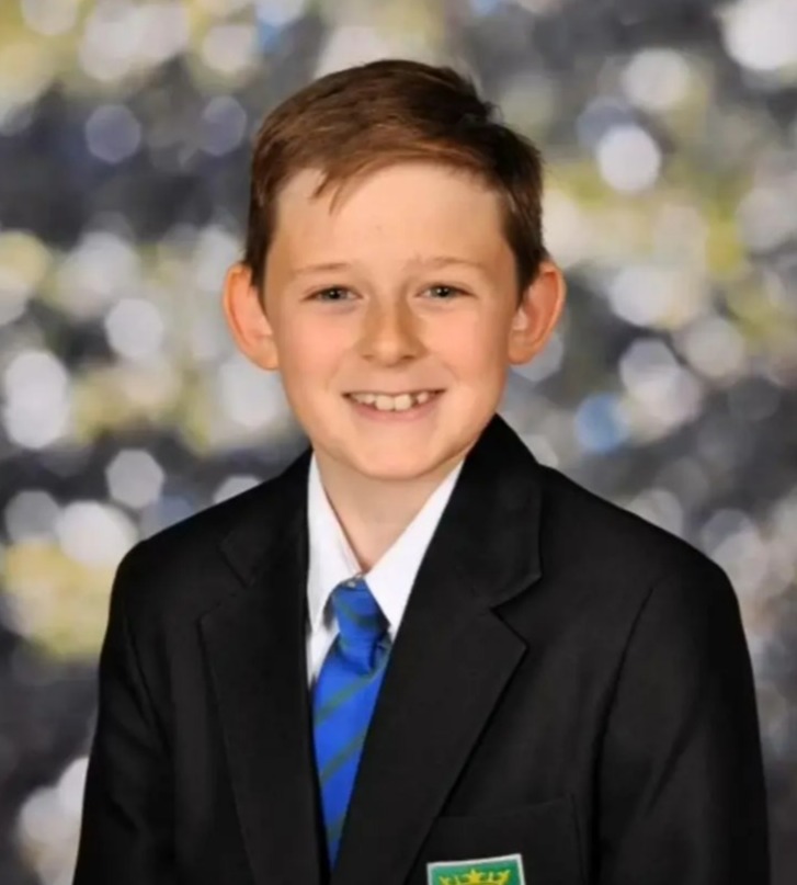 Photo of Katie in school uniform.