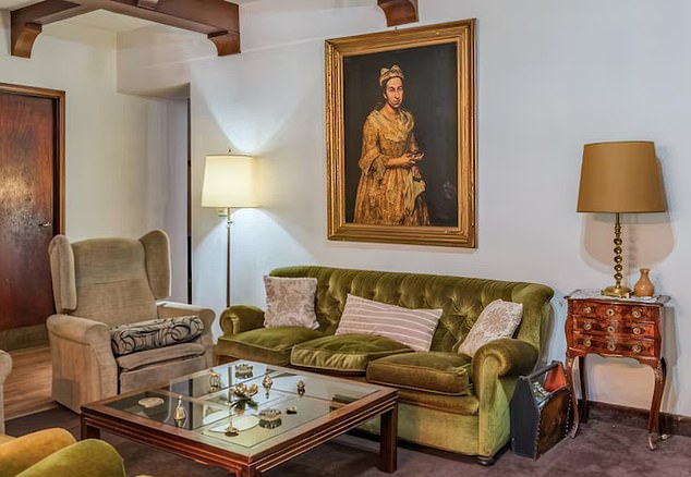 'Portrait of a Lady was pictured hanging over a sofa in a real estate listing posted by Robles Casas & Campos