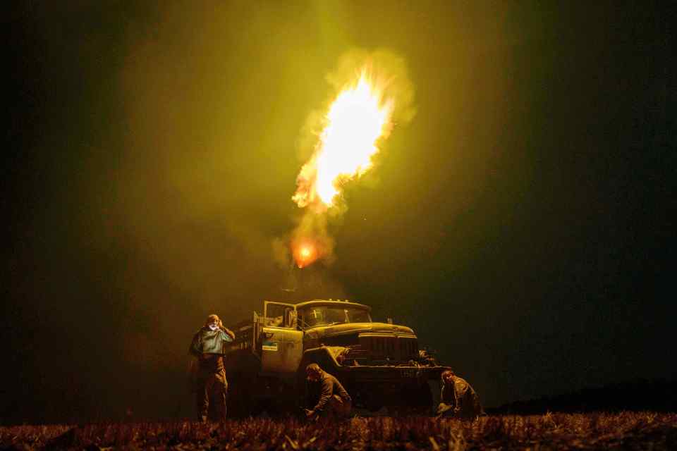 Ukrainian soldiers firing on Russian drones.