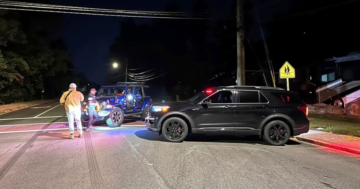 Police block a road to Sky Meadow Country Club in Nashua, New Hampshire, after a shooting on Saturday.