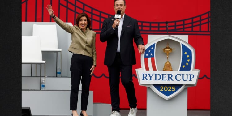Kathy Hochul, governor of New York, and Carson Daly speak to the crowd Wednesday during the opening ceremony for the 2025 Ryder Cup at Black Course at Bethpage State Park Golf Course in Farmingdale, New York.