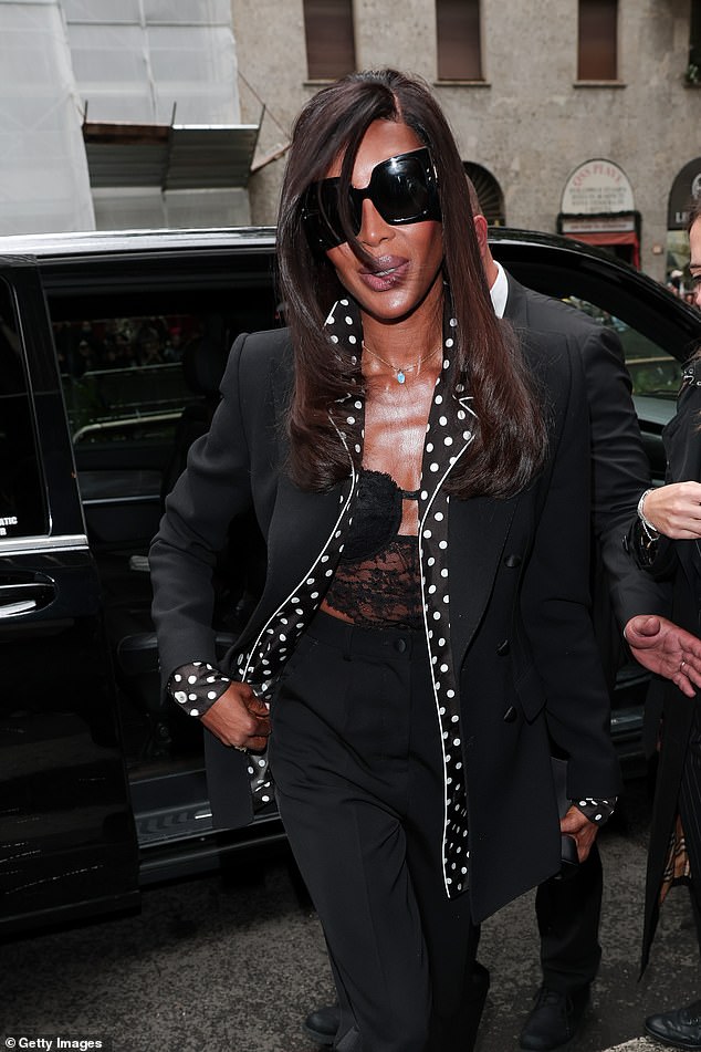 Supermodel Naomi, 55, looked chic in a lace black top layered under a black and white jacket