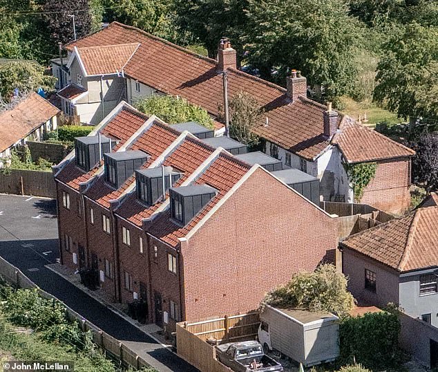 The use of this row of houses (front, left) in a small village in Suffolk as migrant accommodation recently sparked a fierce row