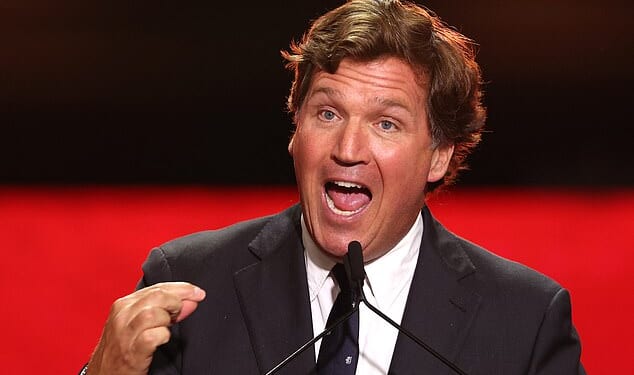 US political commentator Tucker Carlson speaks during the public memorial service for right-wing activist Charlie Kirk at State Farm Stadium in Glendale, Arizona, on September 21, 2025