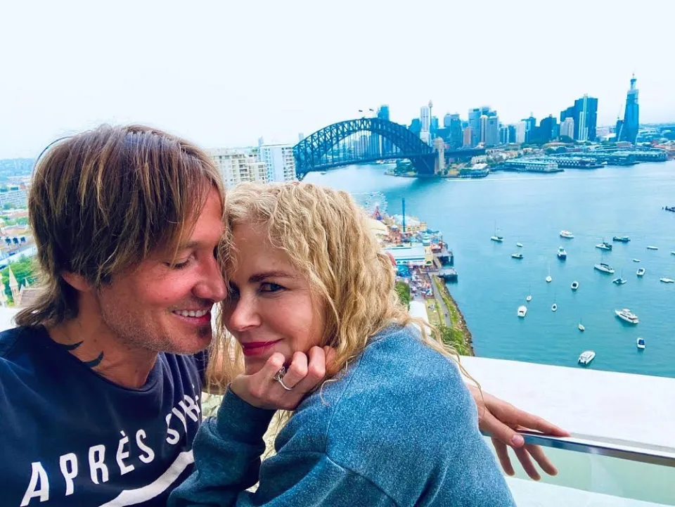 Keith Urban and Nicole Kidman on the balcony of their Sydney, Australia penthouse apartment.