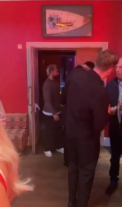 People gathering in a doorway.