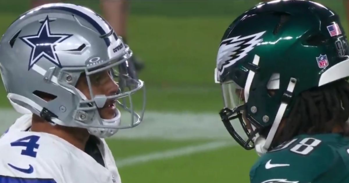 Philadelphia Eagles defensive tackle Jalen Carter, right, spit on Dallas Cowboys quarterback Dak Precott, left, after Prescott spit at him and was subsequently ejected from the game for unsportsmanlike conduct before the first snap of the game on Thursday.
