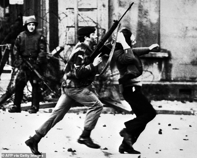 Pictured: A soldier and protester on Bloody Sunday. Former Lance Corporal Soldier F (not pictured), currently on trial for his involvement in the notorious 1972 Bloody Sunday killings in Londonderry, was charged prior to the 2023 Act