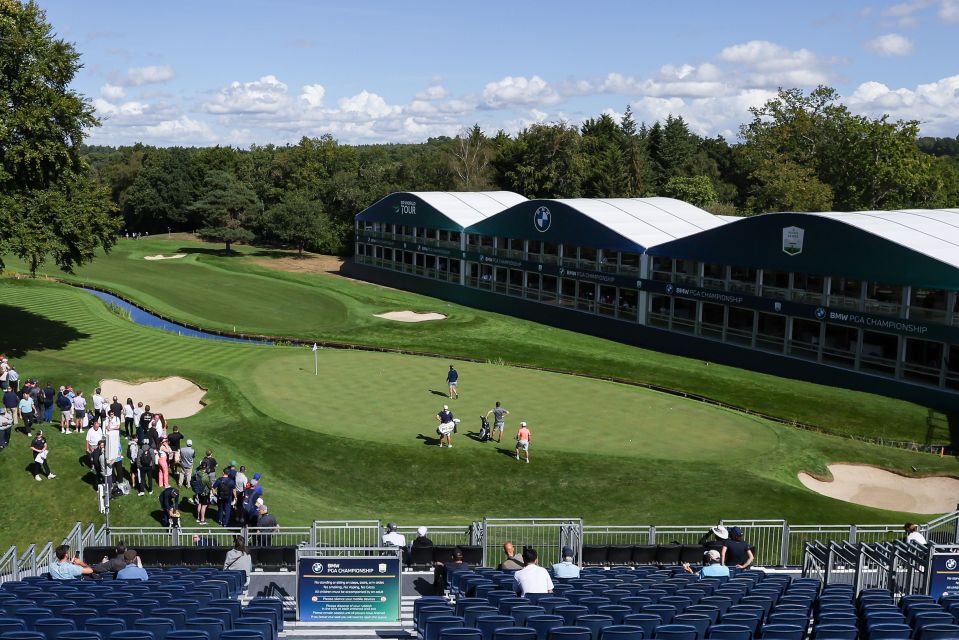 Golfers on the 18th green at the BMW PGA Championship, Wentworth Club.