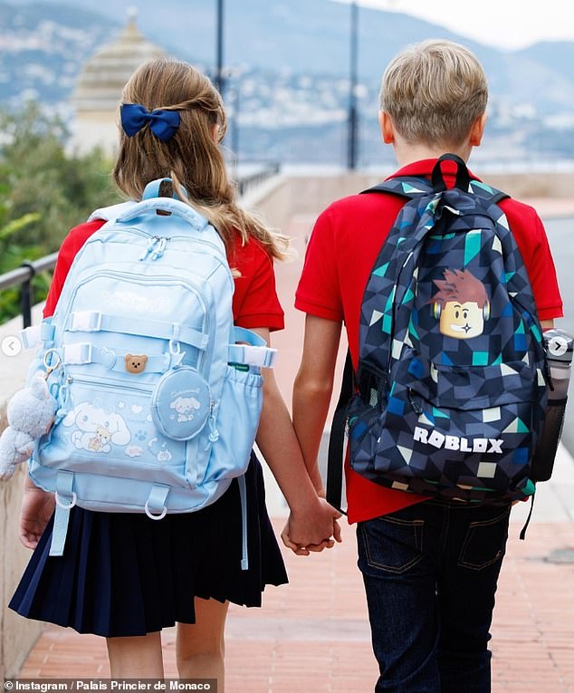 Children of royals may be used to the finest toys and most distinguished spoils available - but the Prince and Princess of Monaco's twins showed they were just like normal kids when they donned Labubu and Roblox merch for the first day back to school