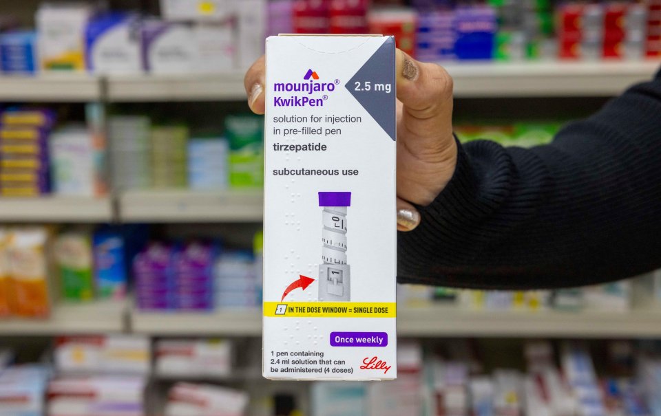 A hand holding a box of Mounjaro KwikPen 2.5mg.