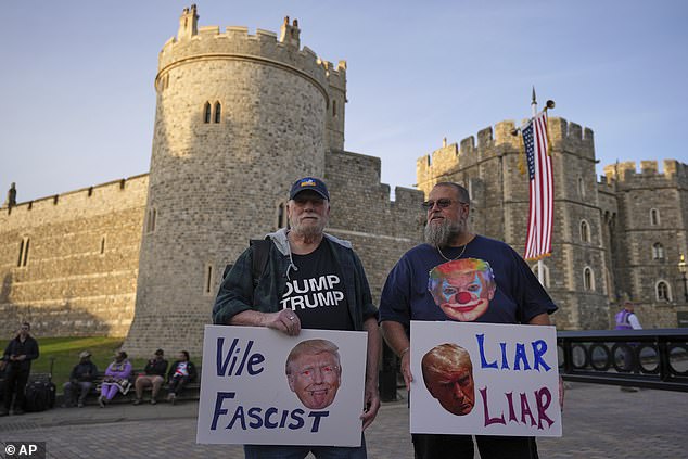 Protesters gather for a demonstration ahead of the arrival of President Donald Trump in Windsor