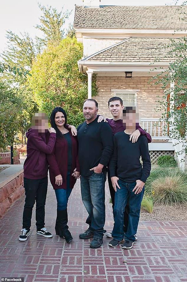 Robinson, 22, accused of killing Charlie Kirk, pictured with his parents Matt and Amber and two younger brothers in a family photo shared online
