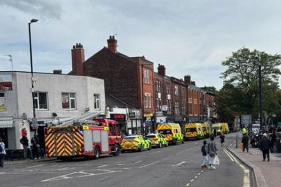 Emergency vehicles on a city street.