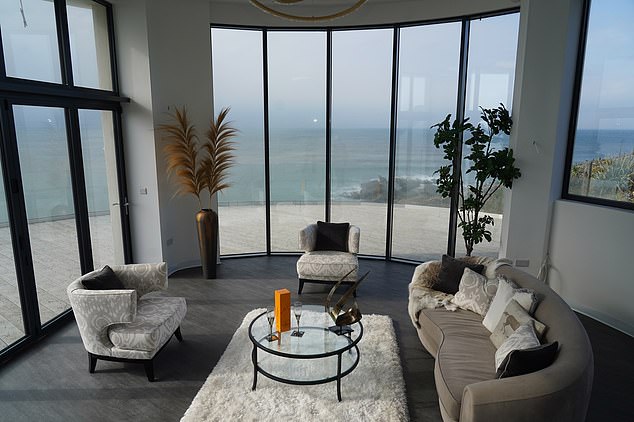 The house is waiting to find a new owner, with Ed hoping he will repay the debts he took on in order to build his North Devon project (pictured: the lounge)