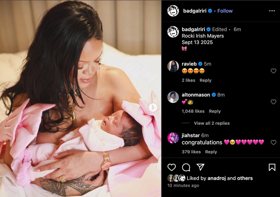 Rihanna holding her newborn baby, wrapped in a pink blanket.