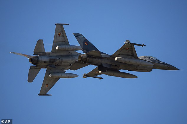 Romania became the latest NATO member state to report a drone incursion into its airspace Saturday, as Poland scrambled aircraft in response to fresh Russian drone strikes just over the border in Ukraine. Pictured: Pilots of the Romanian Air Force flying F-16 fighter jets in August