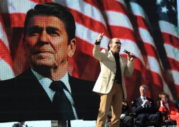 Lee Greenwood, center, sings at the centennial birthday celebration for former President Ronald Reagan at the Reagan Presidential Library in Simi Valley, California, on Feb. 6, 2011.