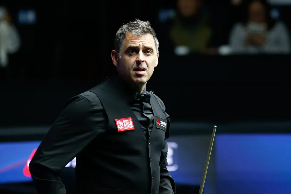 Ronnie O'Sullivan reacting during a snooker match in Shanghai.