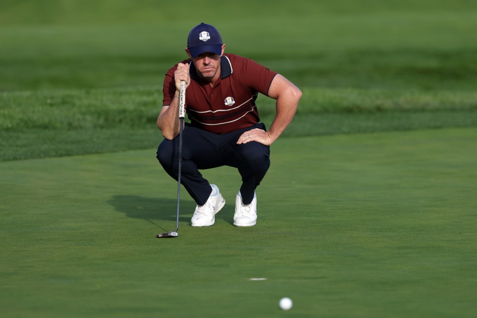 Rory McIlroy of Europe lines up his putt at the 2025 Ryder Cup.