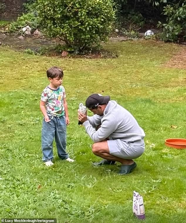 Ryan Thomas enjoyed an emotional reunion with a carrier pigeon that he believes to be the reincarnated spirit of his late father Dougie (pictured with the bird and son Roman)