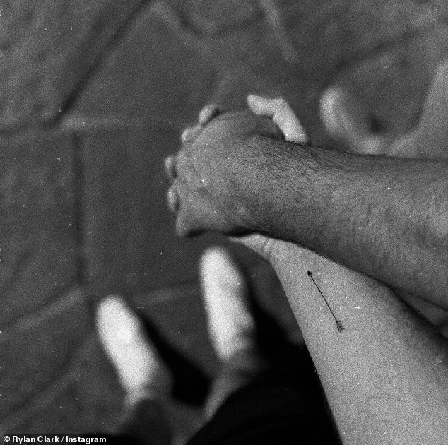 One sweet black-and-white shot showed the TV presenter, 36, and his new boyfriend holding hands as they strolled through the cobbled streets of the historic city