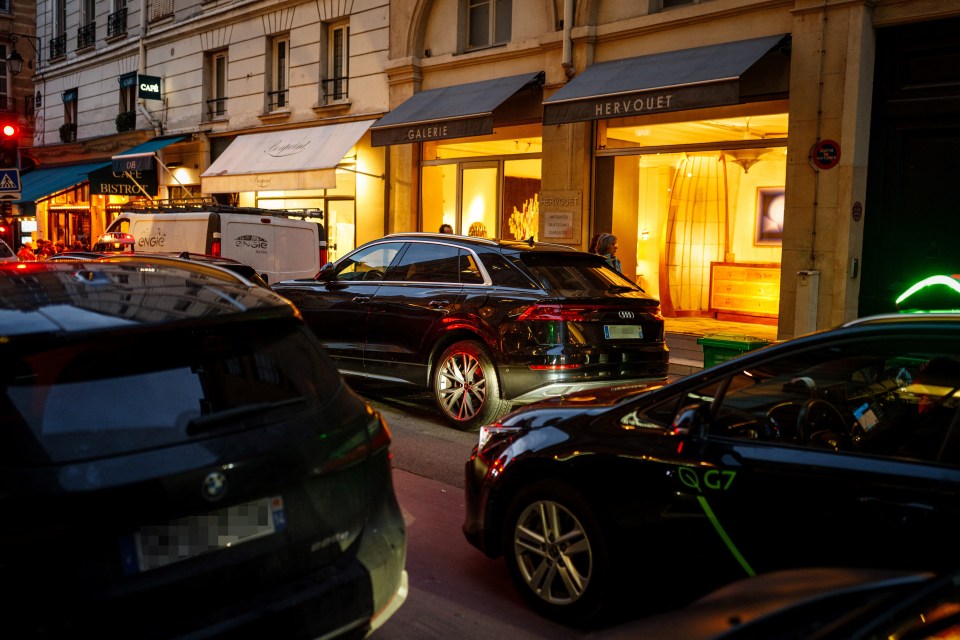 Cars parked in Paris near City Hall during a vote on a parking fee for polluting vehicles.