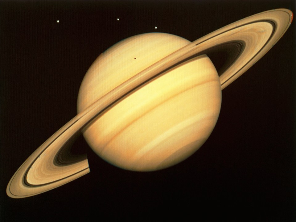 Global view of Saturn and its rings, taken by one of the Voyager probes.