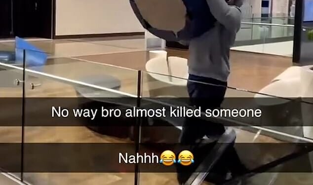 In the footage posted on social media, the boy, wearing a grey hoodie, can be seen hurling a blue seat from the top floor down to the bottom