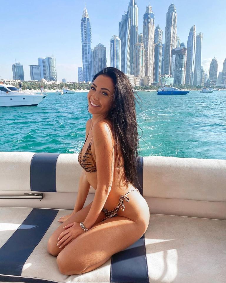 Woman in a bikini on a yacht in Dubai.