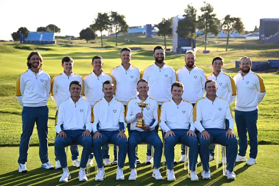 Team Europe golfers pose with the Ryder Cup trophy.