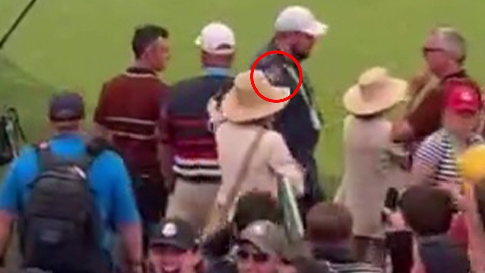 Spectators at a golfing event.