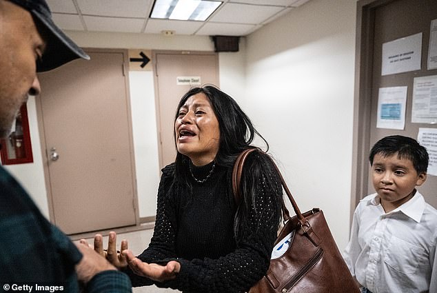 A hysterical mother pleaded with ICE after her husband was ripped away from her by masked agents