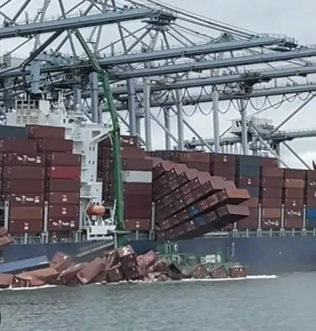Cargo ship containers falling into the sea.