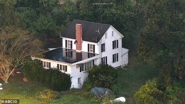 Ruth allegedly murdered the police officers at his ex-girlfriend's home (pictured) during a two minute exchange