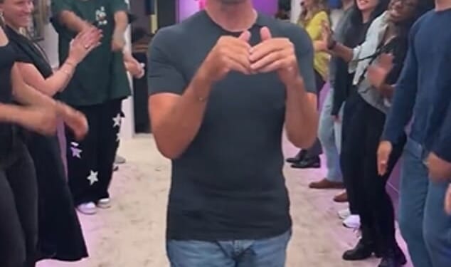 Simon Cowell left fans baffled with his 'awkward' clapping on Monday as he arrived at The Jennifer Hudson Show