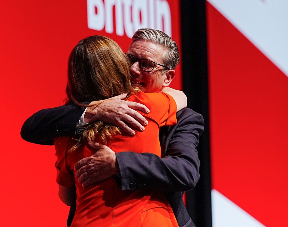 Prime Minister Sir Keir Starmer embraces his wife Lady Victoria at the Labour Party Conference.